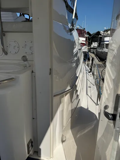  Yacht Photos Pics 1998 Sea Ray 420 Aft Cabin yacht docked, showcasing sleek exterior and walkway.