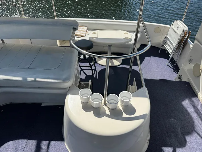  Yacht Photos Pics 1998 Sea Ray 420 Aft Cabin boat interior with seating and cup holders.