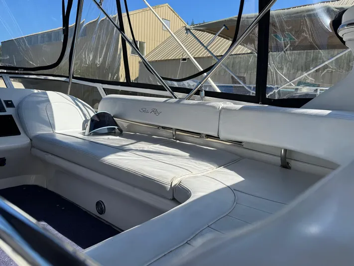  Yacht Photos Pics 1998 Sea Ray 420 Aft Cabin interior with white seating and clear windows.