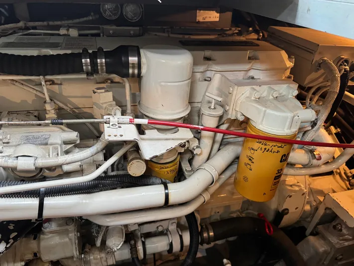  Yacht Photos Pics Engine compartment of a 1998 Sea Ray 420 Aft Cabin boat, showcasing mechanical components.