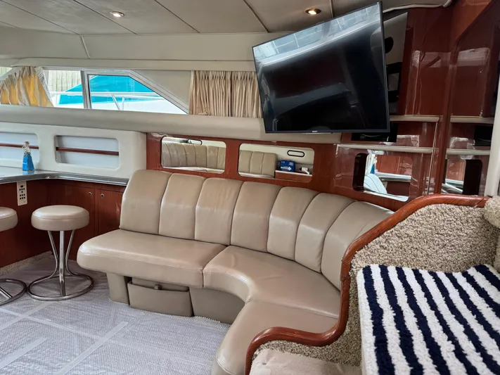 Yacht Photos Pics Luxurious interior of 1998 Sea Ray 420 Aft Cabin yacht with leather seating and TV.