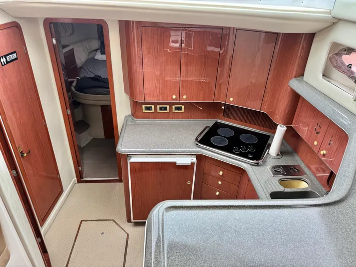  Yacht Photos Pics 1998 Sea Ray 420 Aft Cabin interior with wood cabinetry and modern kitchen amenities.
