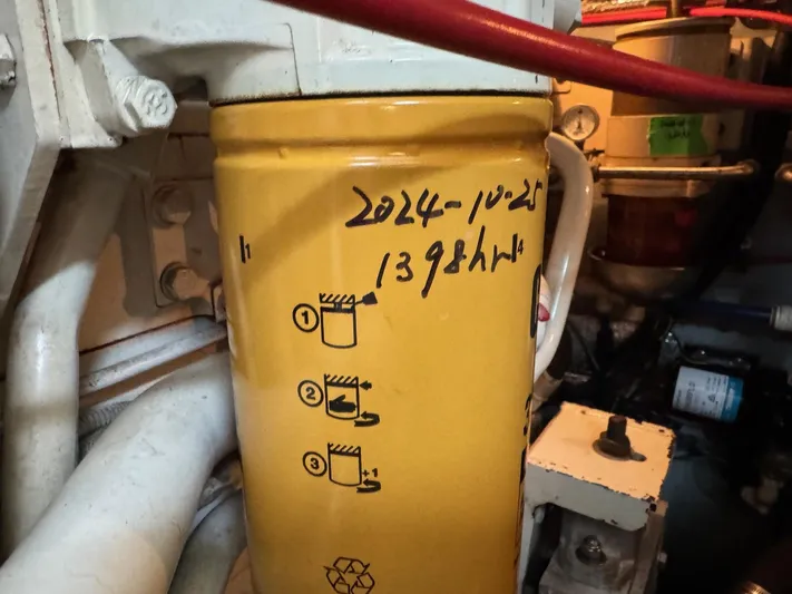  Yacht Photos Pics Engine compartment of 1998 Sea Ray 420 Aft Cabin with labeled yellow filter.