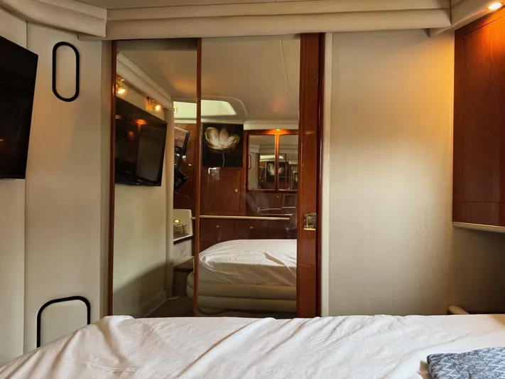  Yacht Photos Pics 1998 Sea Ray 420 Aft Cabin interior with cozy bedroom and elegant wood finishes.