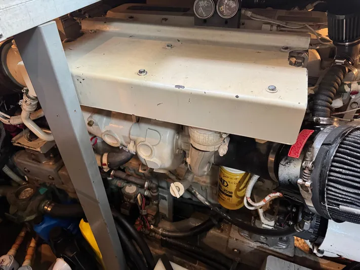  Yacht Photos Pics Engine compartment of a 1998 Sea Ray 420 Aft Cabin boat, showcasing mechanical components.