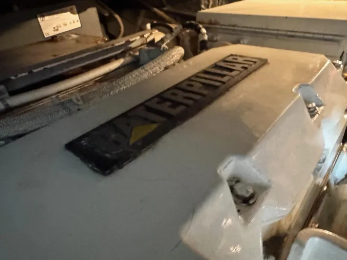  Yacht Photos Pics Engine compartment of a 1998 Sea Ray 420 Aft Cabin with Caterpillar engine.