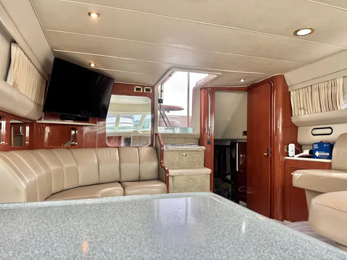  Yacht Photos Pics Luxurious interior of 1998 Sea Ray 420 Aft Cabin yacht with plush seating and modern amenities.