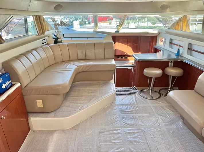  Yacht Photos Pics Luxurious interior of 1998 Sea Ray 420 Aft Cabin yacht with leather seating and dining area.
