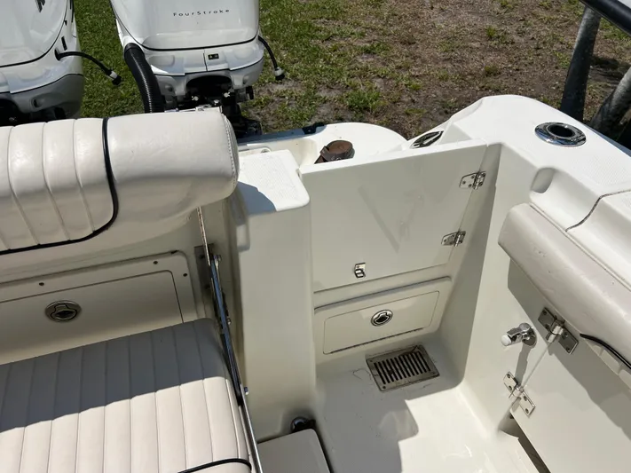  Yacht Photos Pics 2012 Hydra-Sports 3400 CC boat interior with seating and storage compartments.