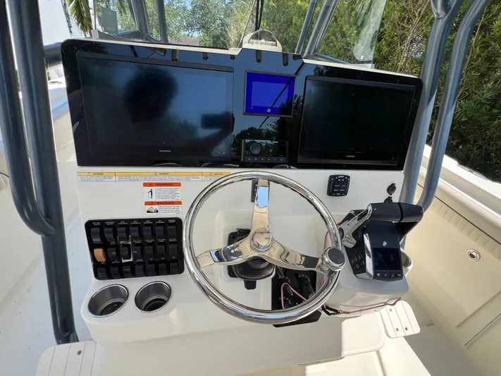  Yacht Photos Pics 2012 Hydra-Sports 3400 CC boat dashboard with dual screens and steering wheel.