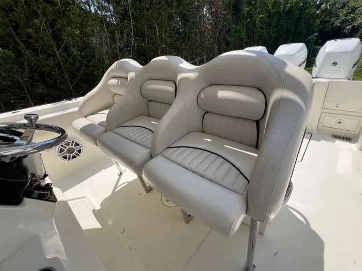  Yacht Photos Pics 2012 Hydra-Sports 3400 CC boat with white cushioned seats and steering wheel.