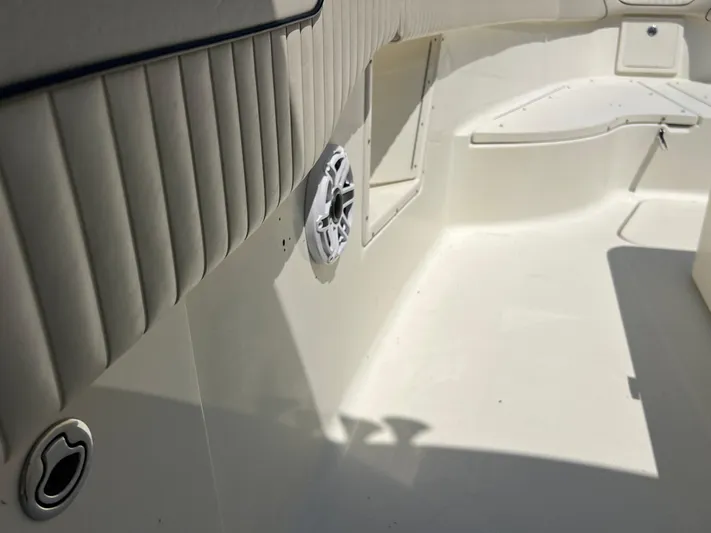  Yacht Photos Pics 2012 Hydra-Sports 3400 CC boat interior with white seating and speaker detail.