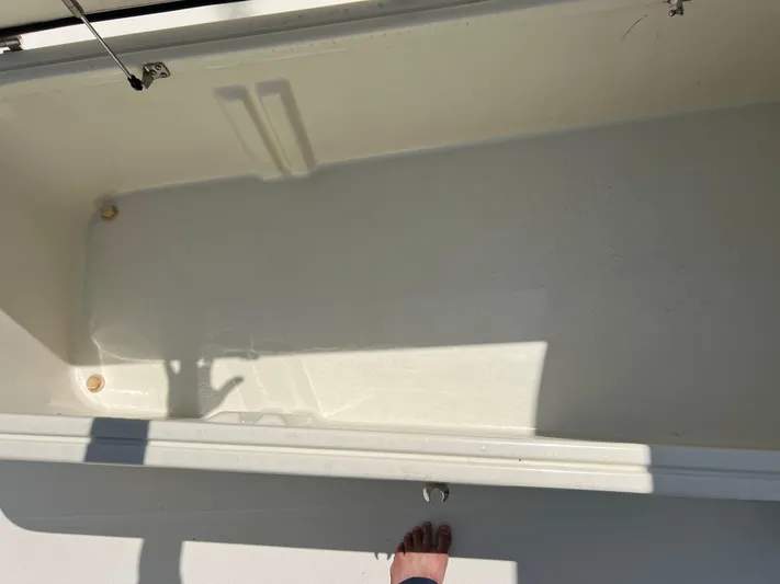  Yacht Photos Pics 2012 Hydra-Sports 3400 CC boat storage compartment, open and empty.