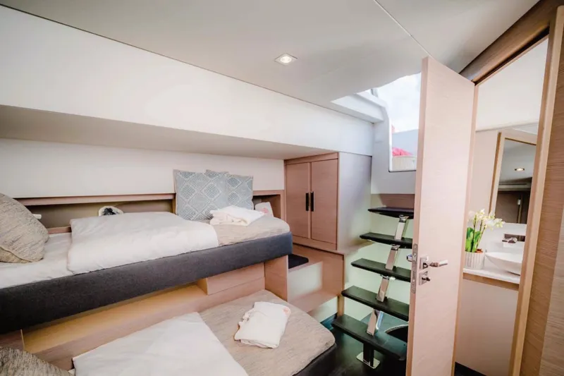  Yacht Photos Pics Luxurious interior of 2021 Fountaine Pajot Samana 59 yacht with modern bunk beds.