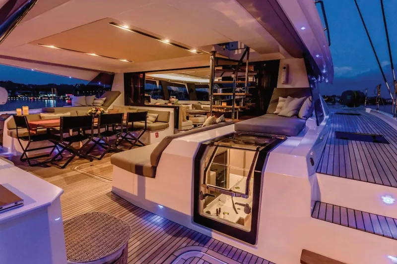 Yacht Photos Pics Luxurious 2021 Fountaine Pajot Samana 59 yacht interior with elegant seating and ambient lighting.