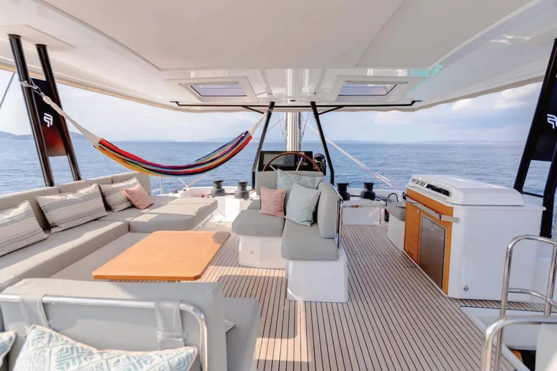  Yacht Photos Pics Luxurious 2021 Fountaine Pajot Samana 59 yacht interior with hammock and ocean view.