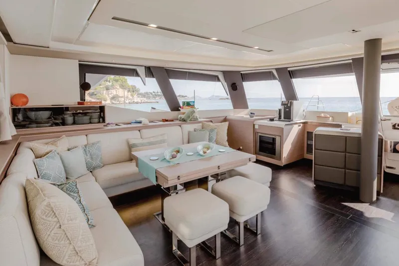  Yacht Photos Pics Luxurious interior of 2021 Fountaine Pajot Samana 59 yacht with modern furnishings and ocean view.