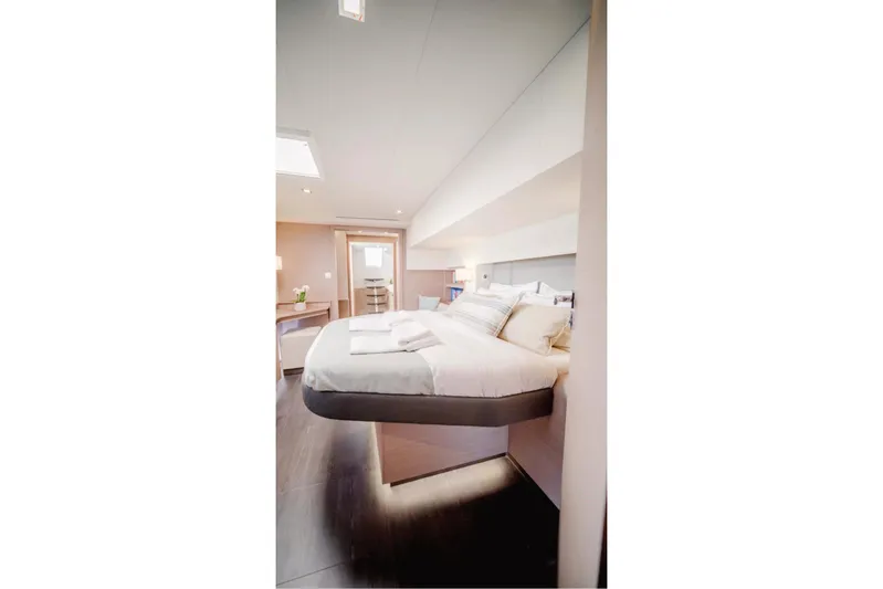  Yacht Photos Pics Luxurious bedroom interior of 2021 Fountaine Pajot Samana 59 yacht, featuring modern design.