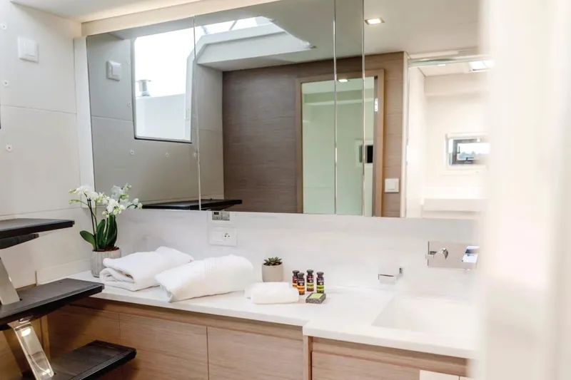  Yacht Photos Pics Luxurious bathroom interior of 2021 Fountaine Pajot Samana 59 yacht with modern amenities.