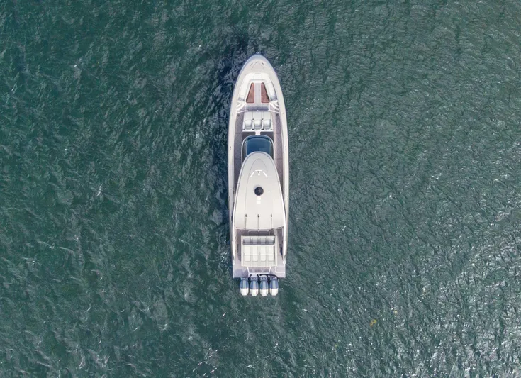  Yacht Photos Pics Aerial view of 2024 Mystic Powerboats M5200 on open water.