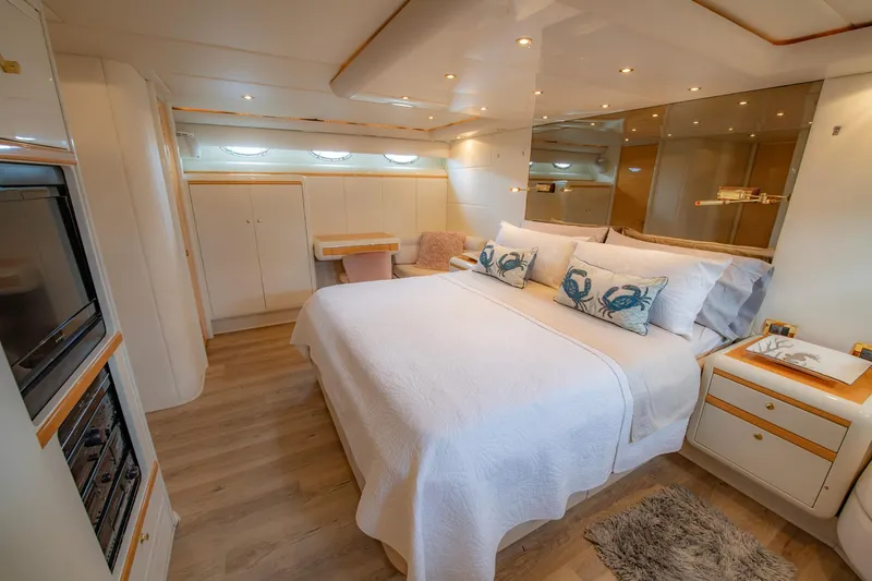 Sea Journey Yacht Photos Pics Luxurious bedroom interior of 1997 Lazzara 76 Motor Yacht with elegant decor.
