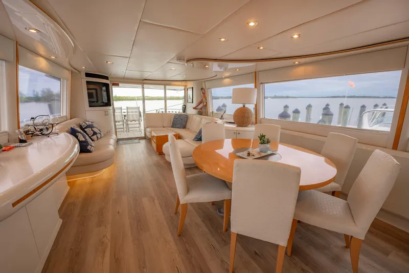 Sea Journey Yacht Photos Pics Luxurious interior of 1997 Lazzara 76 Motor Yacht with elegant dining area and scenic views.