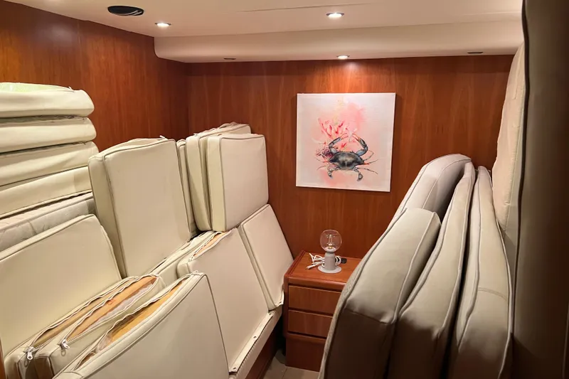  Yacht Photos Pics Interior of 2009 Castagnola 24 yacht with stacked cushions and crab artwork.