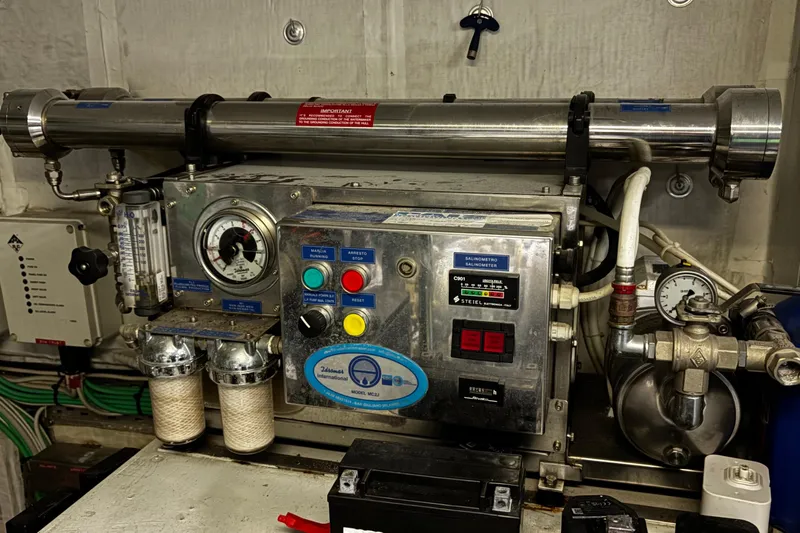  Yacht Photos Pics Engine room machinery in a 2009 Castagnola 24 yacht, featuring gauges and control panel.