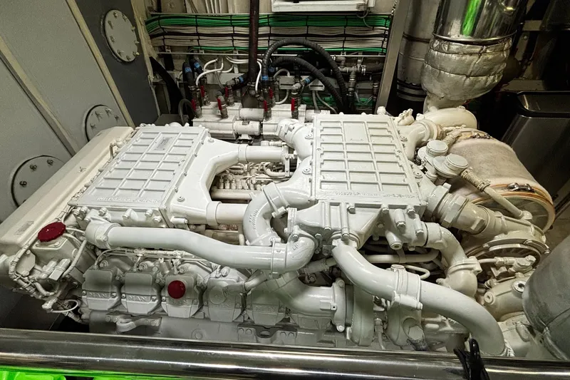  Yacht Photos Pics Engine room of a 2009 Castagnola 24 yacht, showcasing complex machinery and piping.
