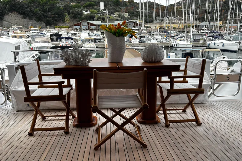  Yacht Photos Pics Luxurious Castagnola 24 yacht deck with elegant dining setup, 2009 model.