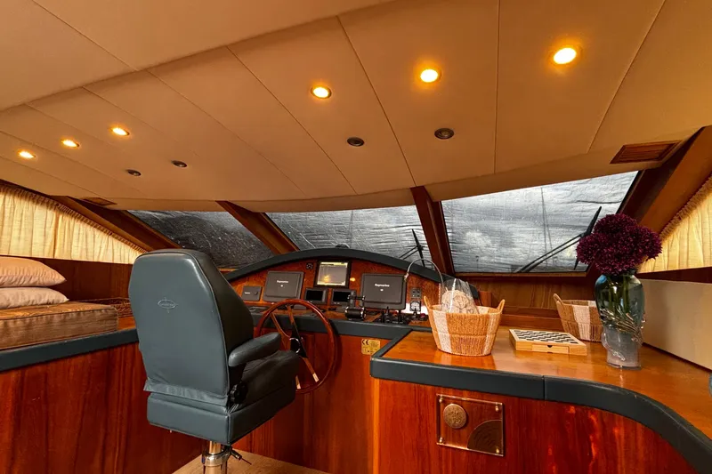  Yacht Photos Pics Luxurious 2009 Castagnola 24 yacht interior with elegant wood finish and modern navigation equipment.