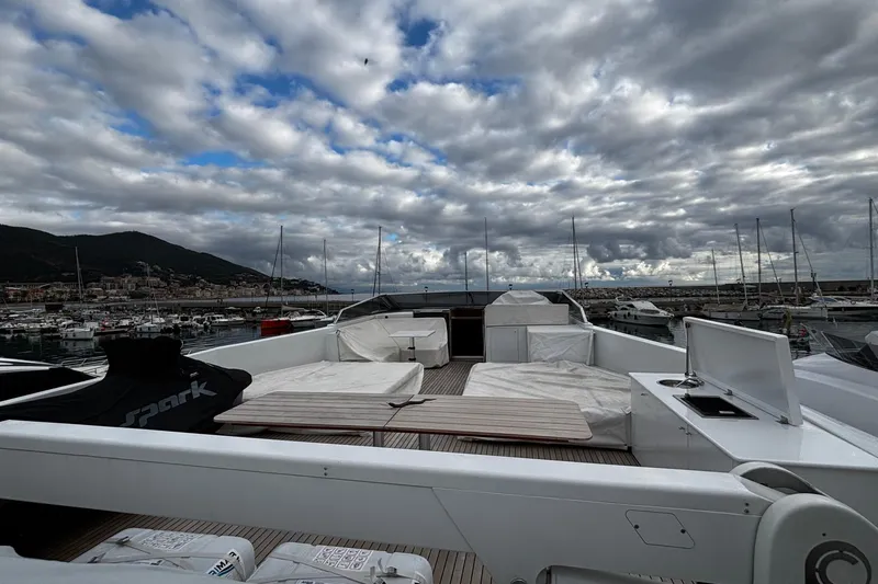  Yacht Photos Pics Luxurious 2009 Castagnola 24 yacht deck with marina view under cloudy sky.