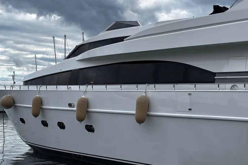  Yacht Photos Pics Luxury yacht Castagnola 24, 2009 model, docked under cloudy skies.