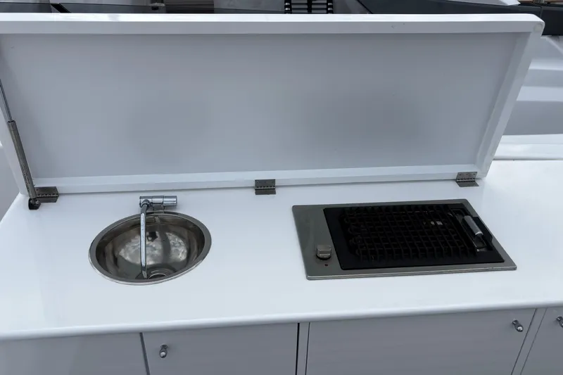  Yacht Photos Pics Outdoor kitchen setup on 2009 Castagnola 24 yacht with sink and grill.