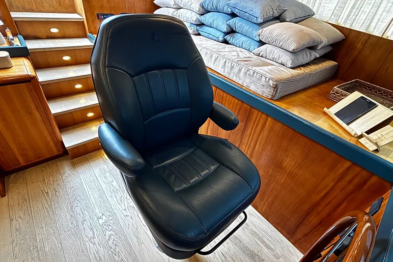  Yacht Photos Pics Luxurious interior of 2009 Castagnola 24 yacht with leather chair and wooden accents.