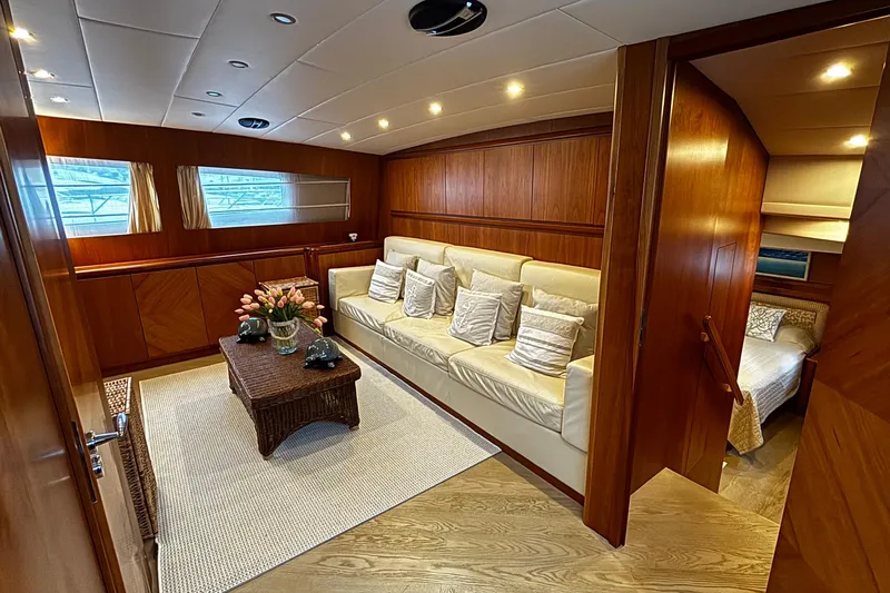  Yacht Photos Pics Luxurious interior of 2009 Castagnola 24 yacht with elegant wood paneling and plush seating.