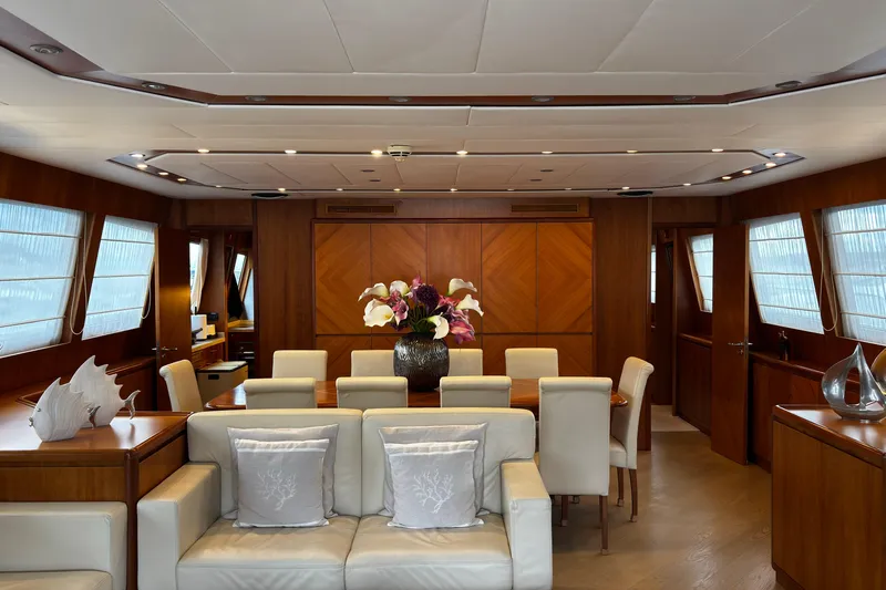  Yacht Photos Pics Luxurious interior of 2009 Castagnola 24 yacht with elegant dining area and plush seating.