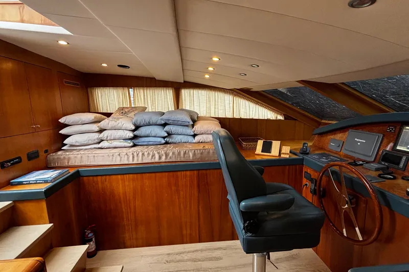  Yacht Photos Pics Luxurious 2009 Castagnola 24 yacht interior with helm, cushions, and wooden accents.