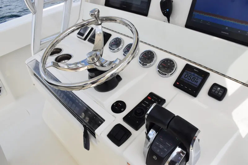  Yacht Photos Pics 2020 SeaVee 370z boat helm with steering wheel and control panel.