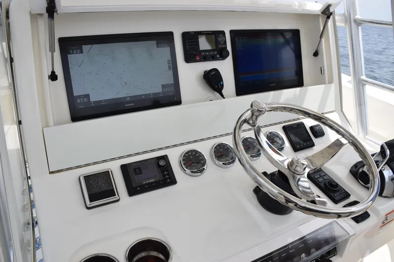  Yacht Photos Pics 2020 SeaVee 370z boat dashboard with navigation screens and steering wheel.