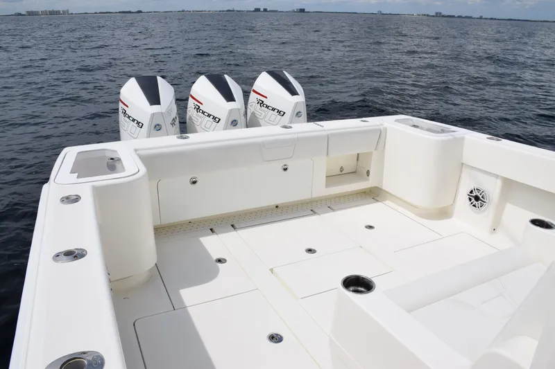  Yacht Photos Pics 2020 SeaVee 370z boat deck with triple outboard engines on open water.