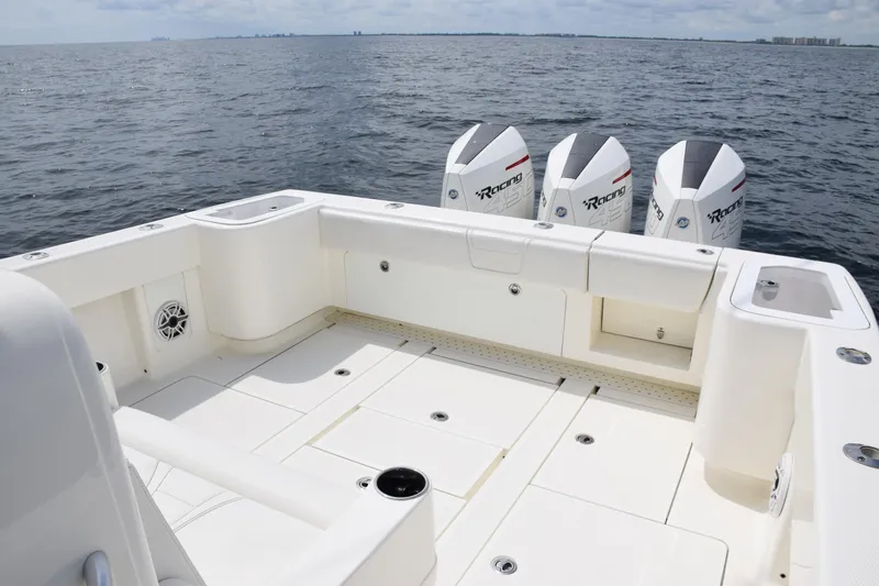  Yacht Photos Pics 2020 SeaVee 370z boat deck with triple outboard engines on open water.