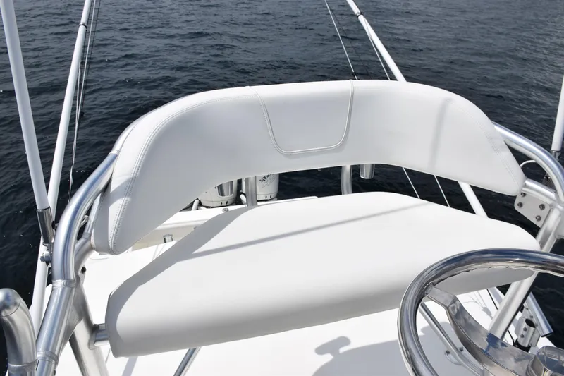  Yacht Photos Pics 2020 SeaVee 370z boat helm with white seating and steering wheel.