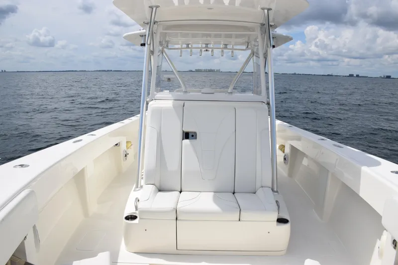  Yacht Photos Pics 2020 SeaVee 370z boat interior with seating, on open water under cloudy sky.
