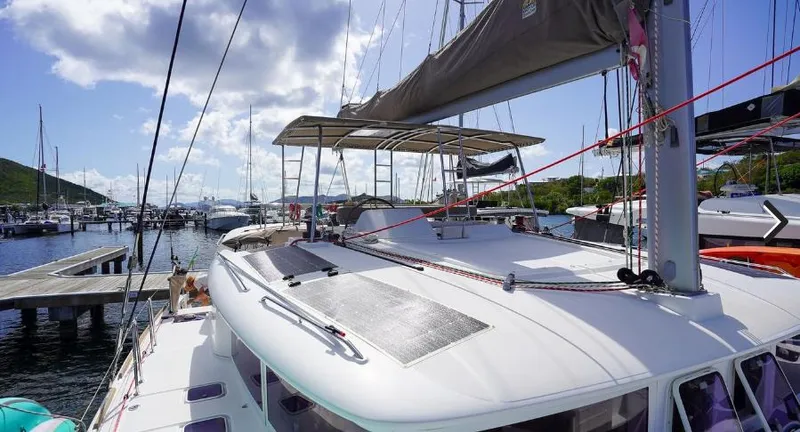 Great Adventure Yacht Photos Pics 2014 Lagoon 450 catamaran docked at marina under sunny skies.