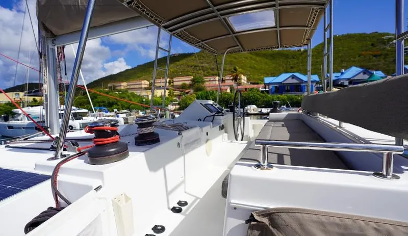 Great Adventure Yacht Photos Pics Lagoon 450 catamaran deck, 2014 model, docked with scenic hillside view.
