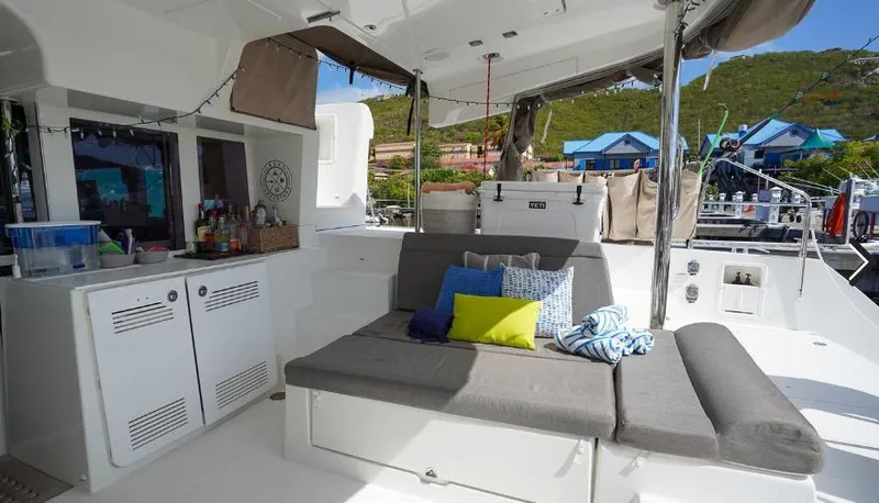 Great Adventure Yacht Photos Pics Interior of 2014 Lagoon 450 catamaran with cozy seating and colorful cushions.
