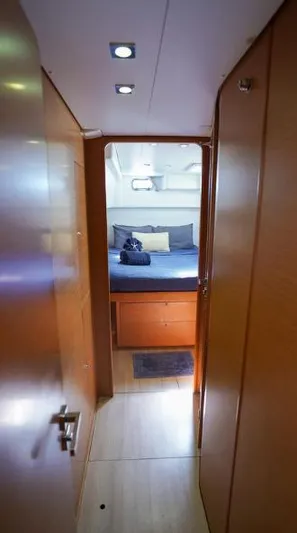 Great Adventure Yacht Photos Pics Interior view of 2014 Lagoon 450 yacht cabin with modern wood finish.
