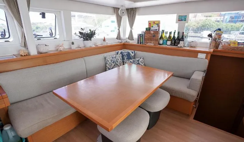 Great Adventure Yacht Photos Pics Interior of 2014 Lagoon 450 catamaran with cozy dining area and modern decor.