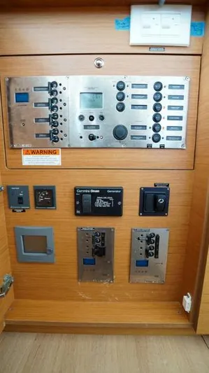 Great Adventure Yacht Photos Pics Control panel of a 2014 Lagoon 450 yacht with various switches and displays.